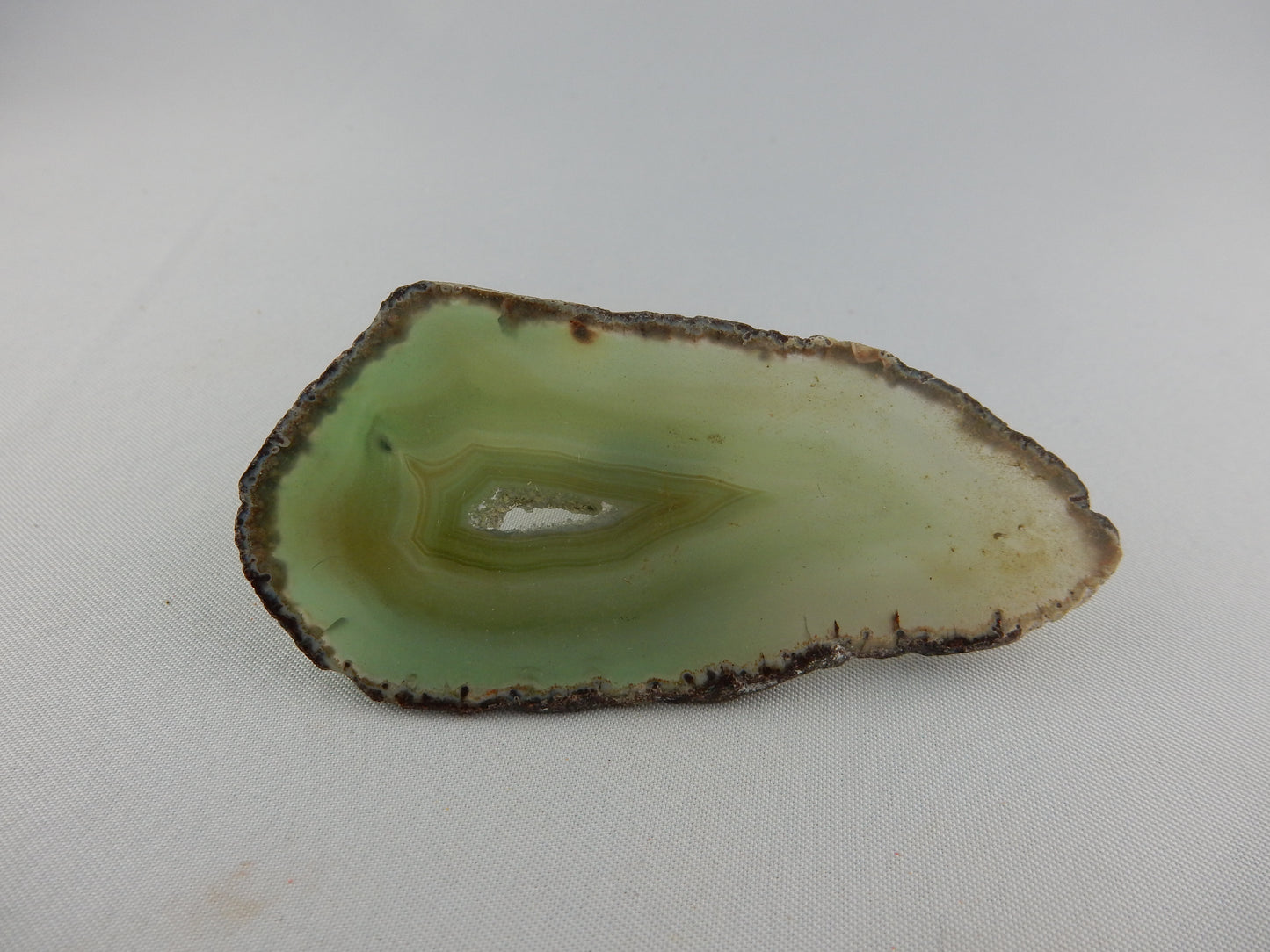 polished gemmy slab of full round of agate - green hollow center