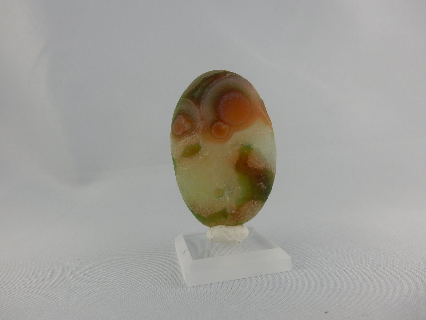 Colourful and complex natural rough cab of "eyed" Gobi agate - orange-green-white- unique