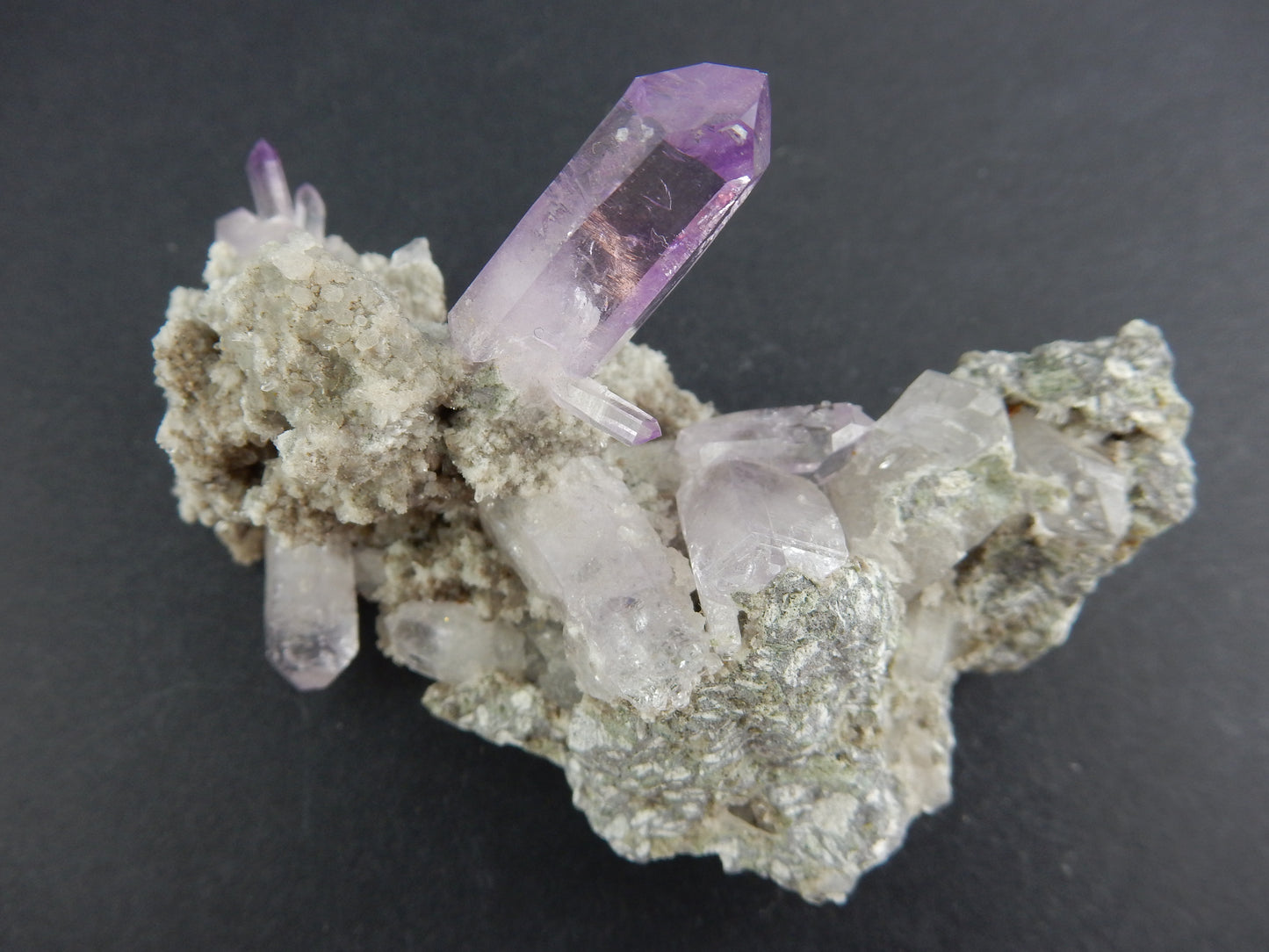 awesome cluster of classic Vera Cruz - one big gemmy purple crystal and many others to show off - sits perfect