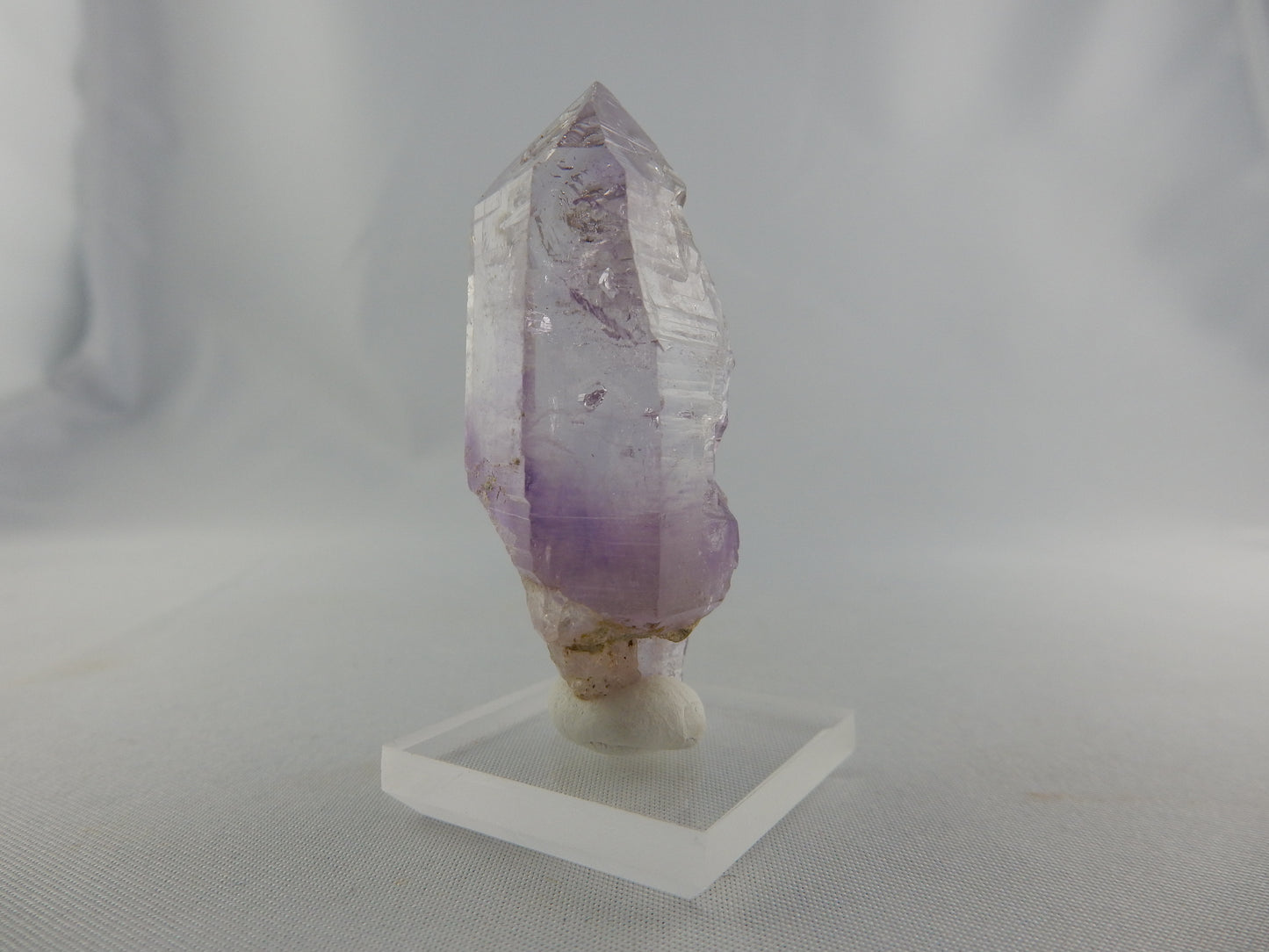 Gemmy perfect terminated point of classic Goosamebebe quartz with smokey amethyst phantom