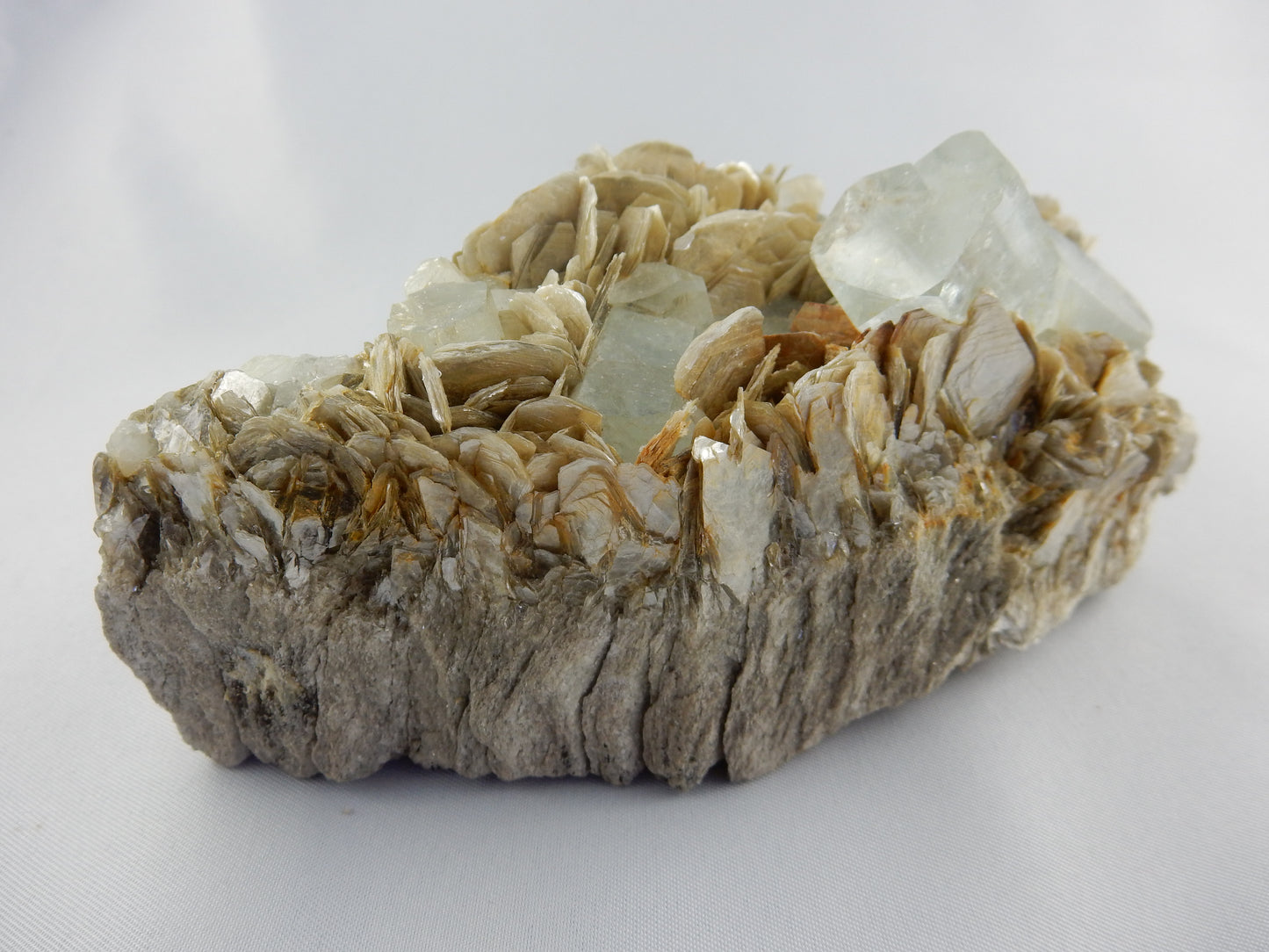 Aquamarine cluster - sky-blue multiple x 10 perfectly terminated aquas on a nice bed of sparkly muscovite, nice presented