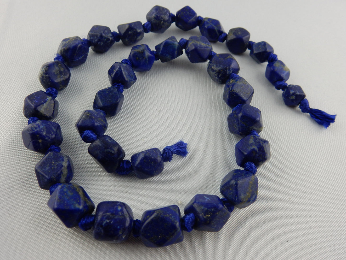 deep saturated blue dodecahedral Lapis Lazuli beads ready to be strung and worn as a very rare necklace