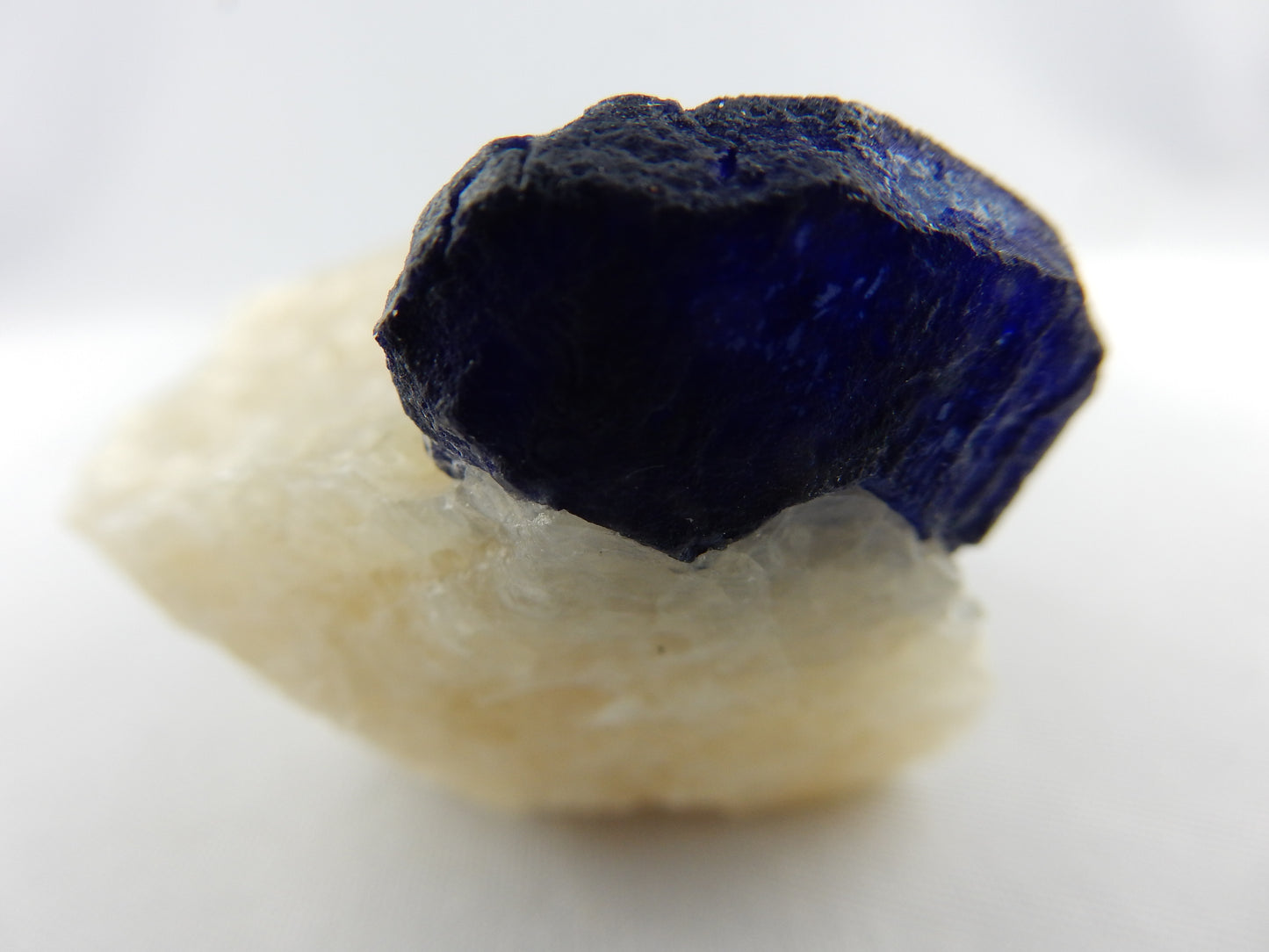 Excellent specimen of fully-double terminated Lazurite crystal (clear/gemmy) - nicely presented on matrix of white marble