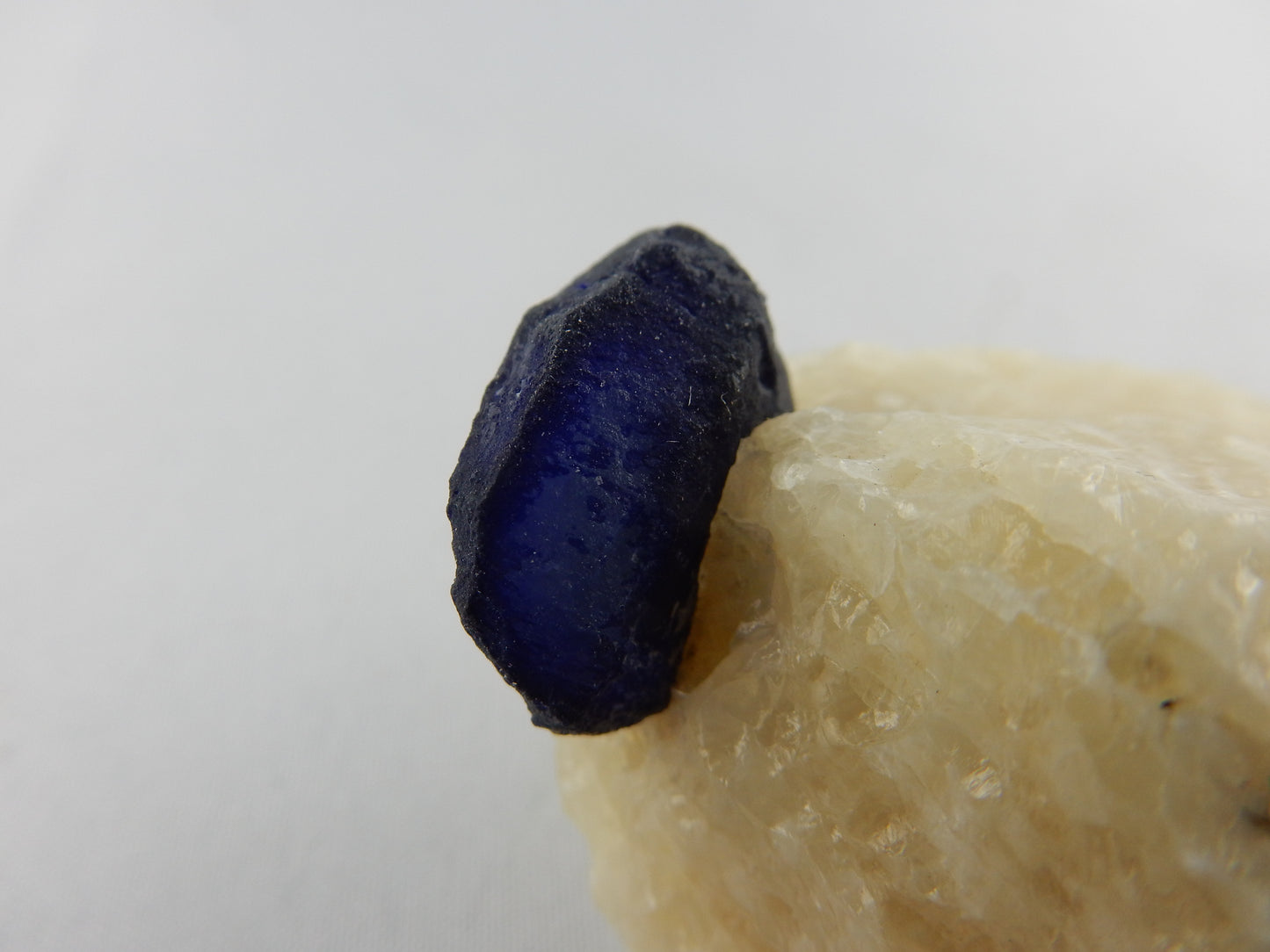 Lazurite Crystal on Marble