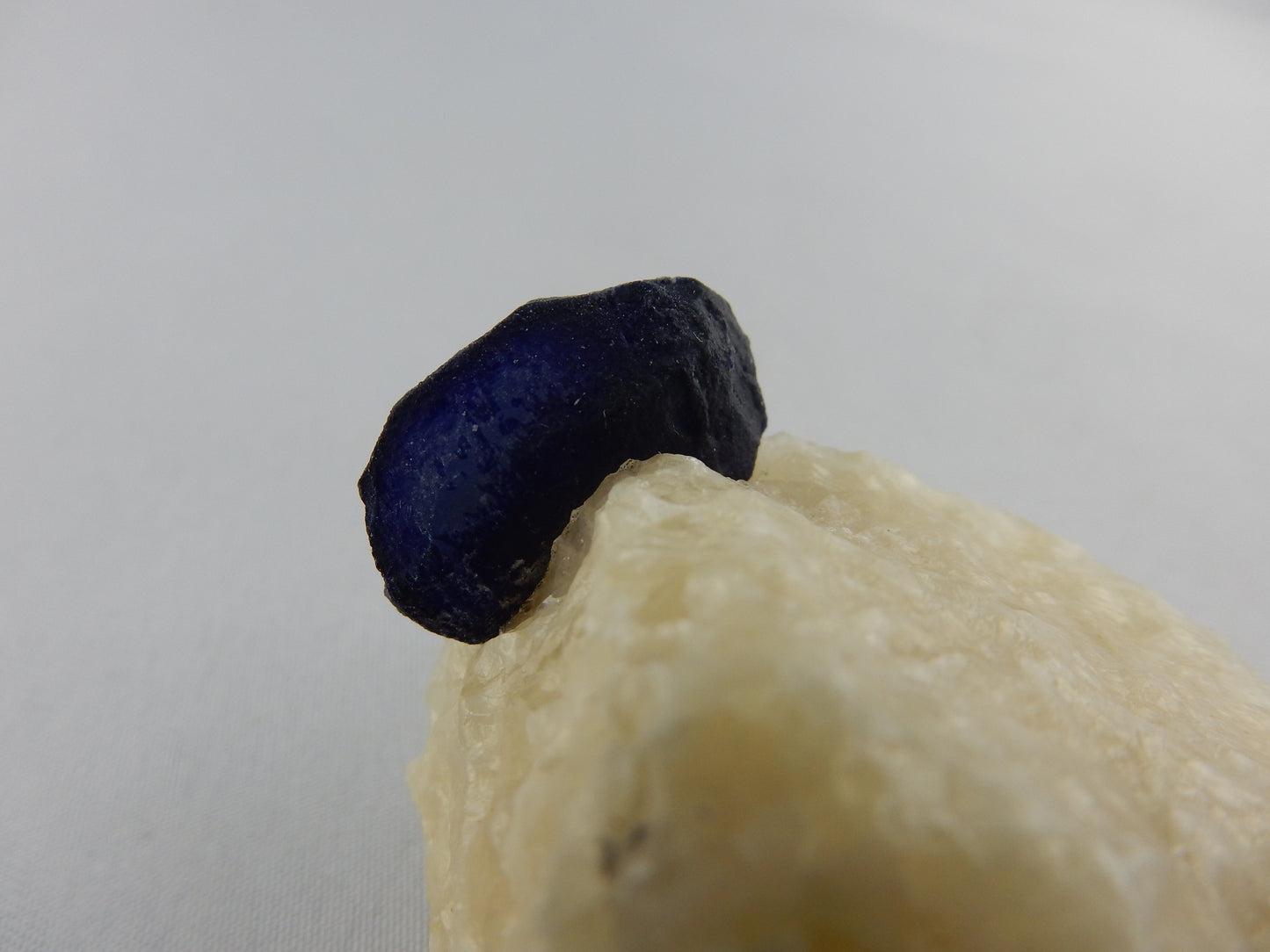 Lazurite Crystal on Marble