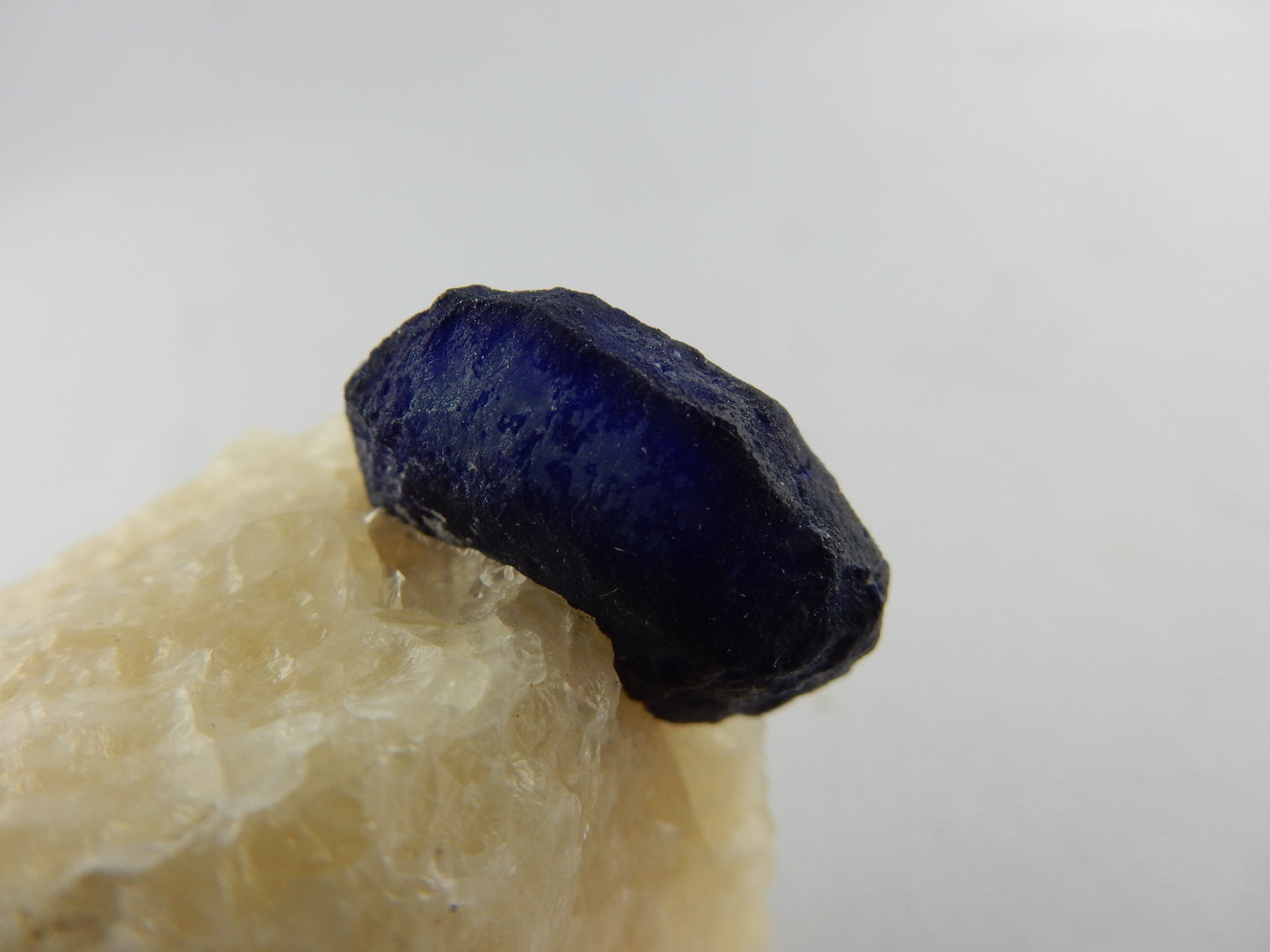 Lazurite Crystal on Marble