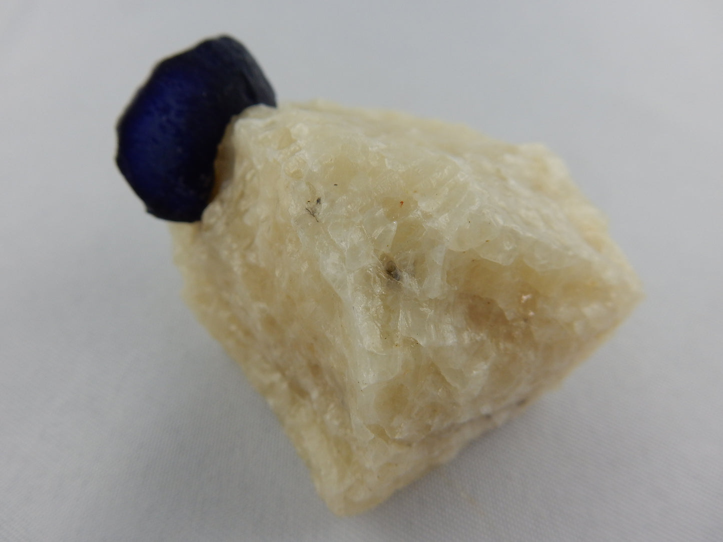 Lazurite Crystal on Marble