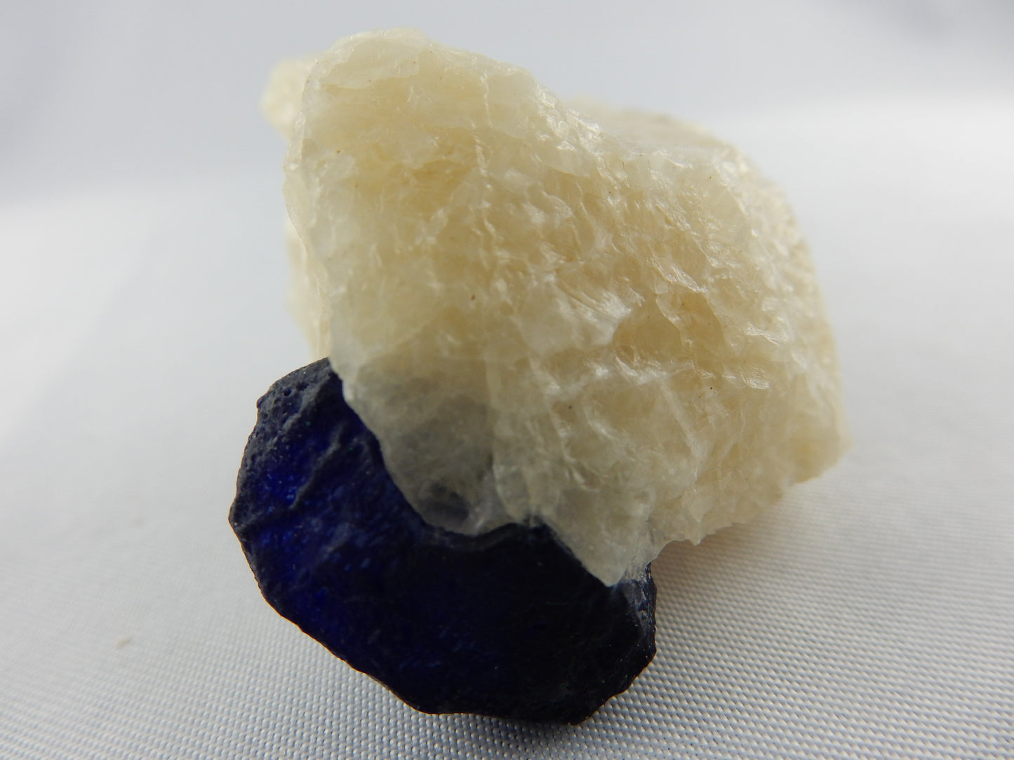 Lazurite Crystal on Marble