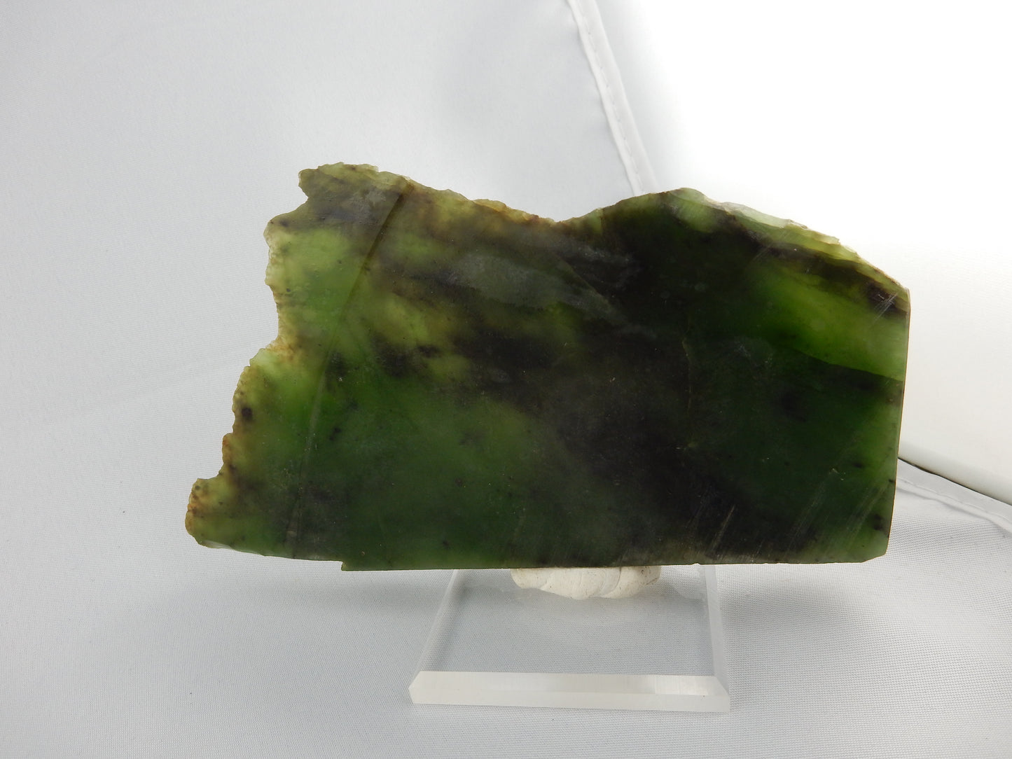 Slab translucent specimen (or polishing raw) of NZ "Kawakawa" - deep gemmy green/back highlights