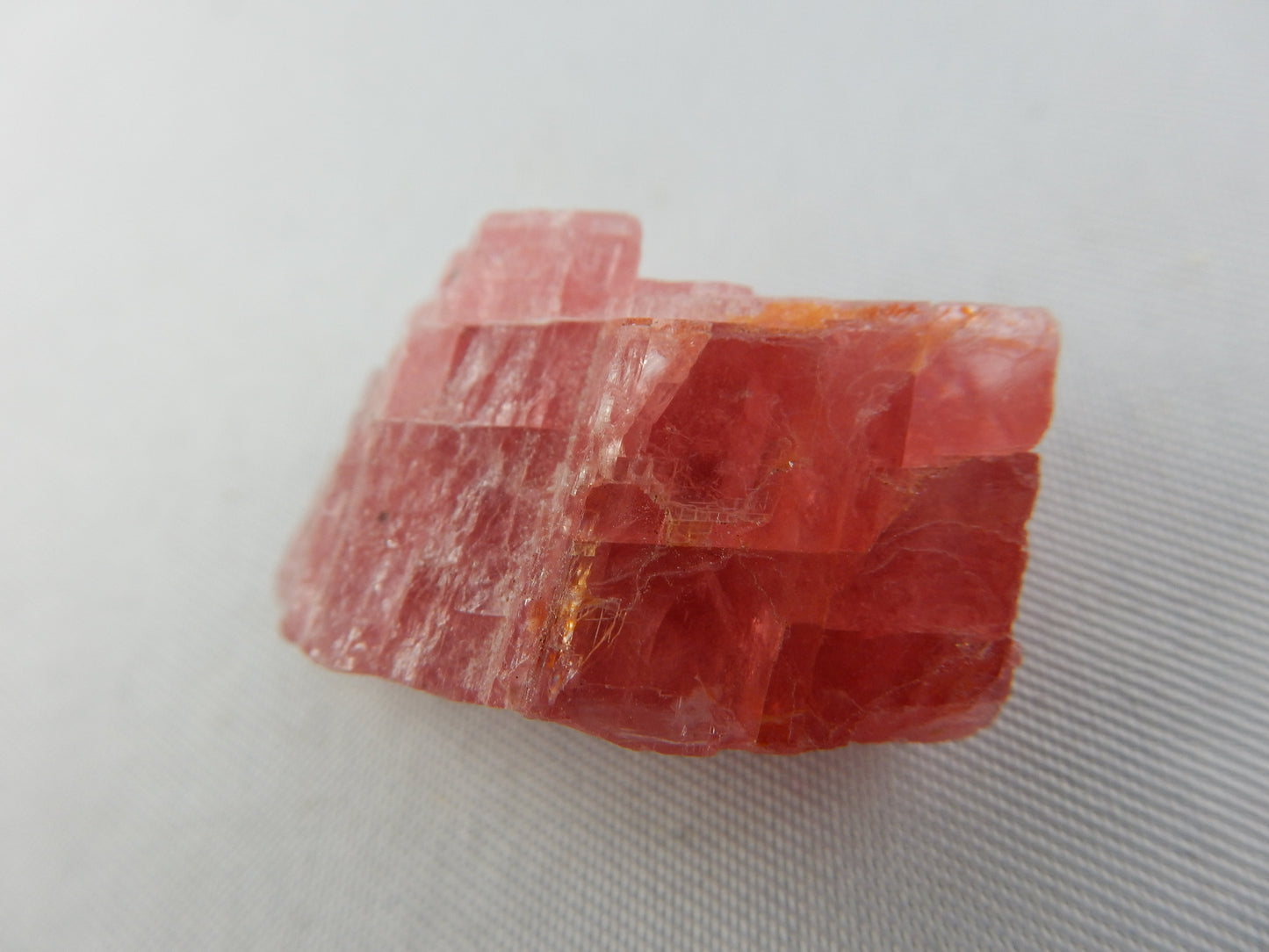 Rhodochrosite, Cherry-red gemmy rhomb cleavage crystal