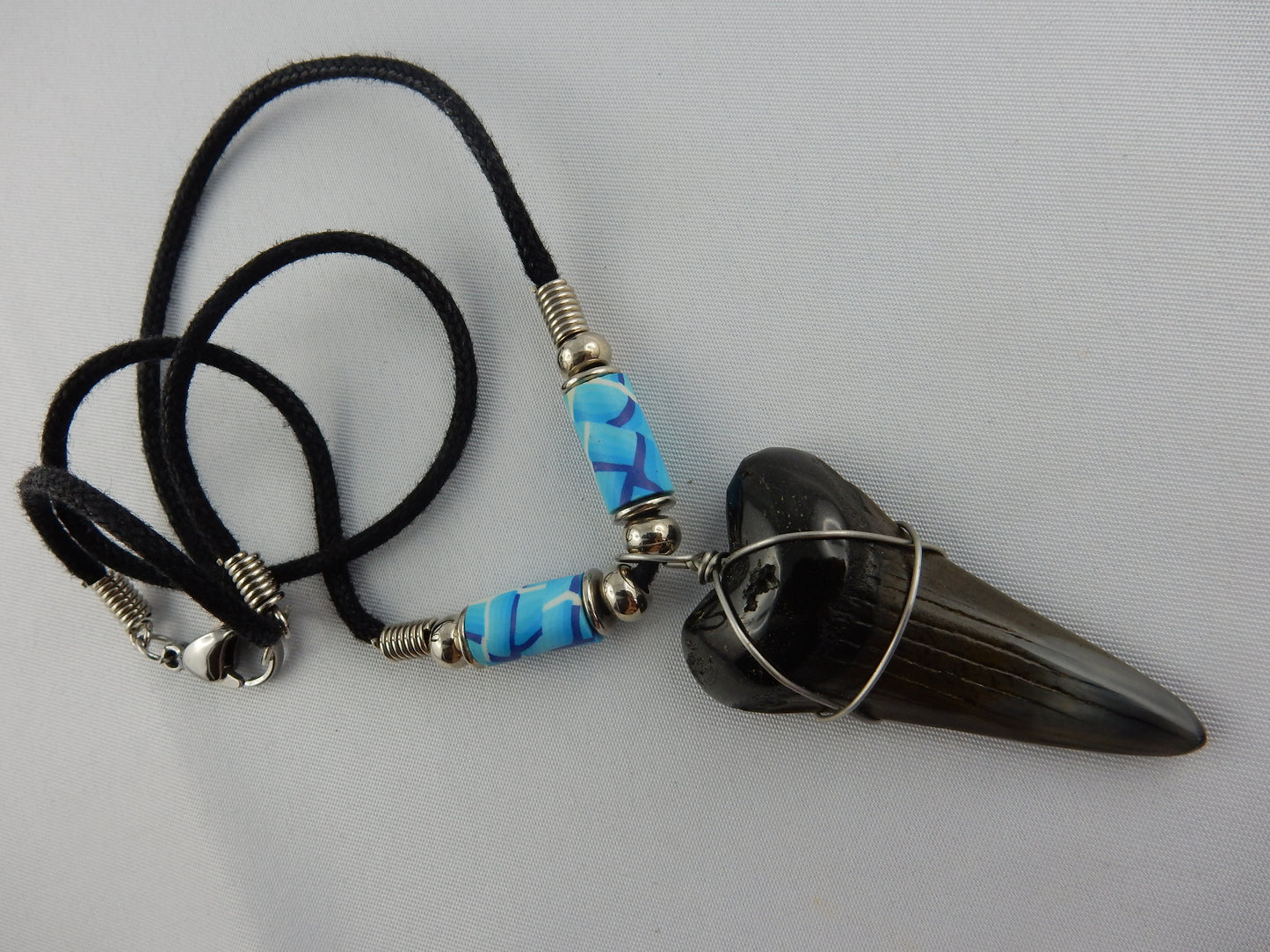 nicely polished complete mako-shaped ancient megladon shark tooth - w/blue beads - 30 million years old - necklace