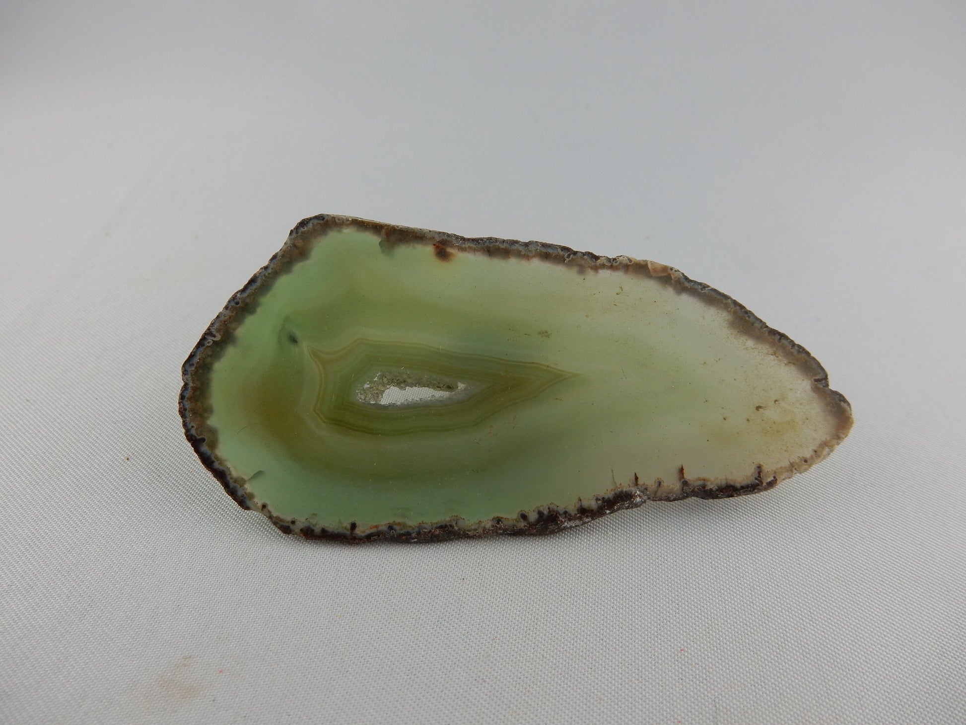 polished gemmy slab of full round of agate - green hollow center