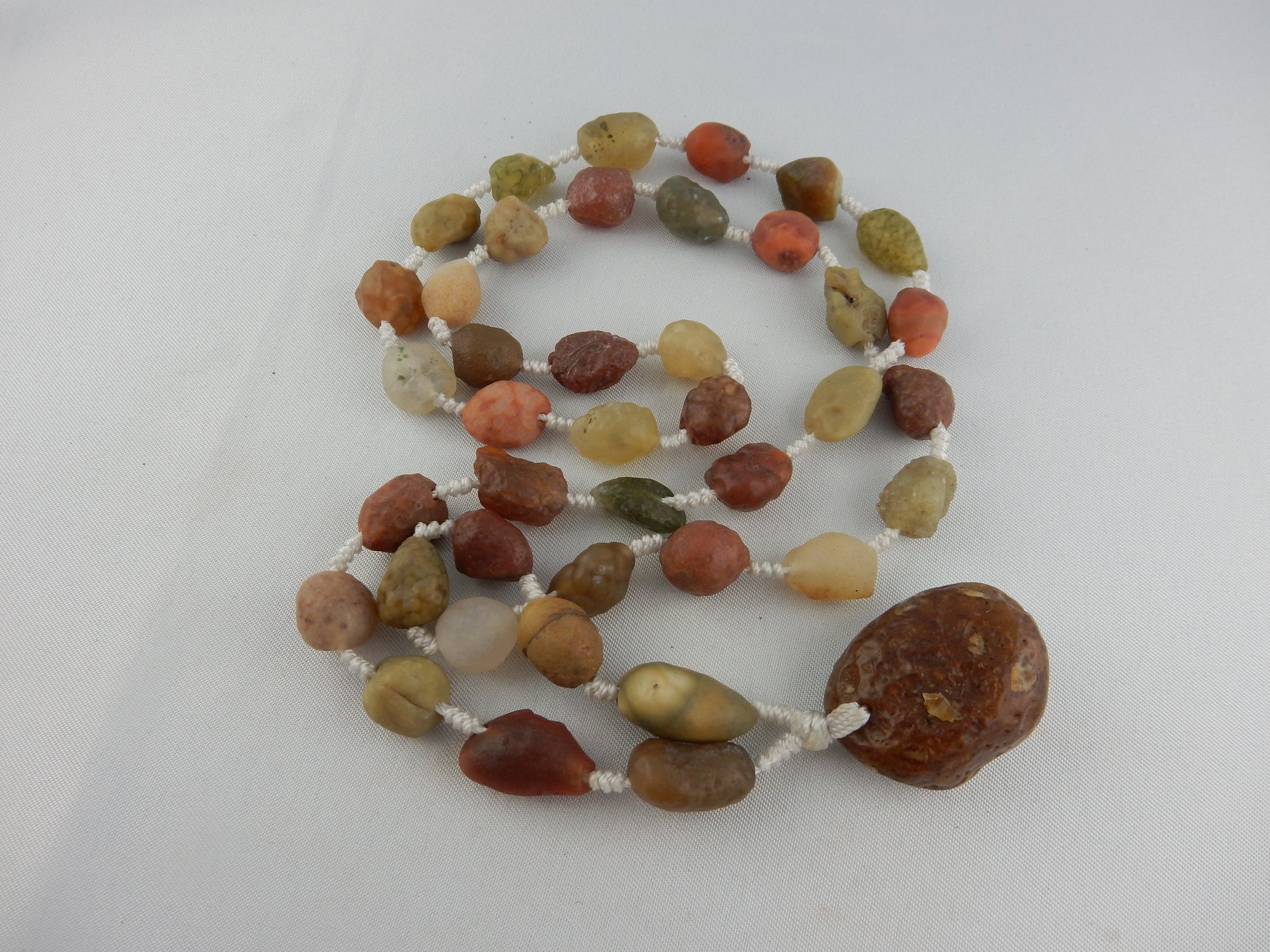Natural gobi desert polished multi-coloured translucent interesting beads with larger end-piece agate