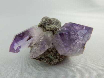 Amethyst with classic deep purple gemmy tips - nice cluster on matrix
