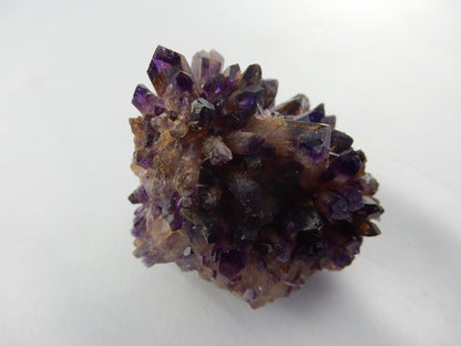 Needle-like gemmy terminated dark amethyst cluster