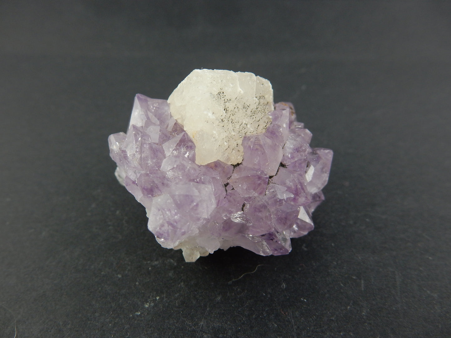 Amethyst with perfect Calcite Cube
