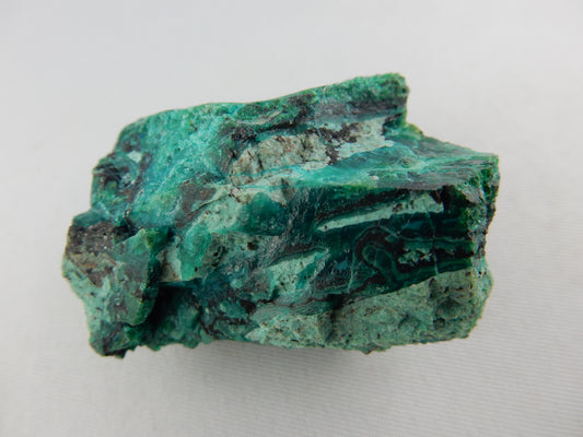 Bright blue-green chrysocolla mixed with red-brown cuprite