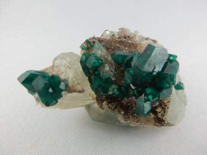 big gemmy intense emerald-green perfectly terminated multiple crystals of Dioptase on quartz matrix