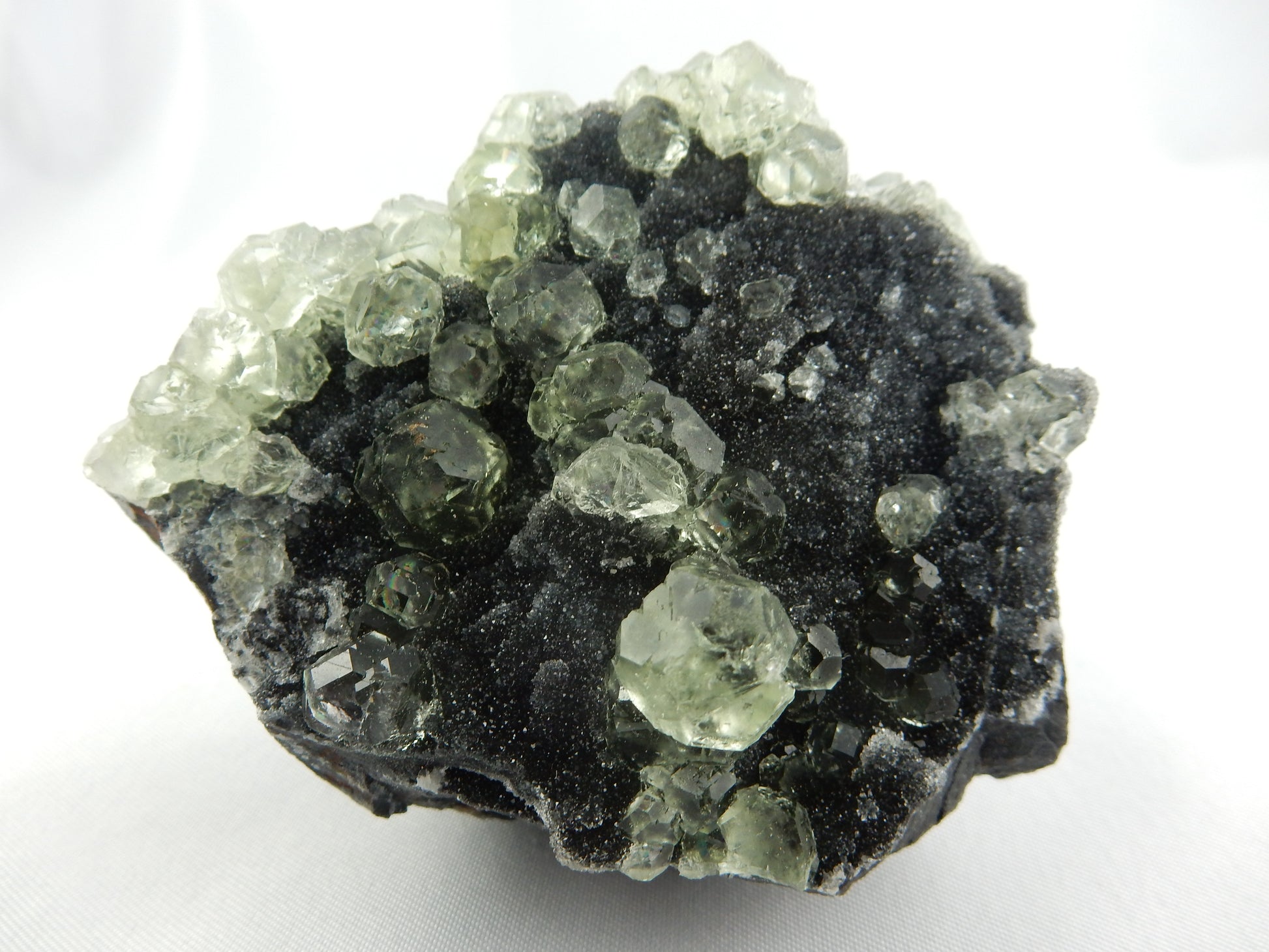Fluorite Balls - complex modified cubic crystal clusters, nicel scattered on dark drusy quartz matrix