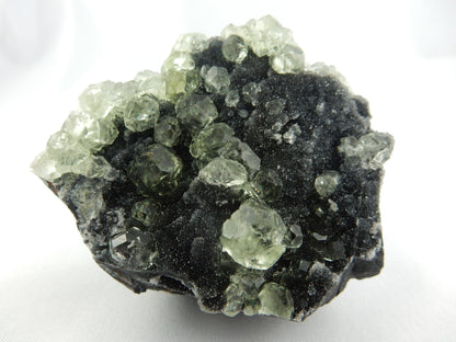 Fluorite Balls - complex modified cubic crystal clusters, nicel scattered on dark drusy quartz matrix