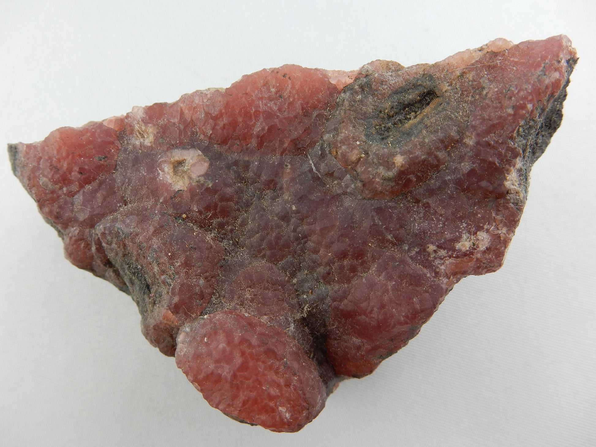 form of Flourite - botryoidal mass (usually cubic crystals, etc) - and arare red colour - translucent