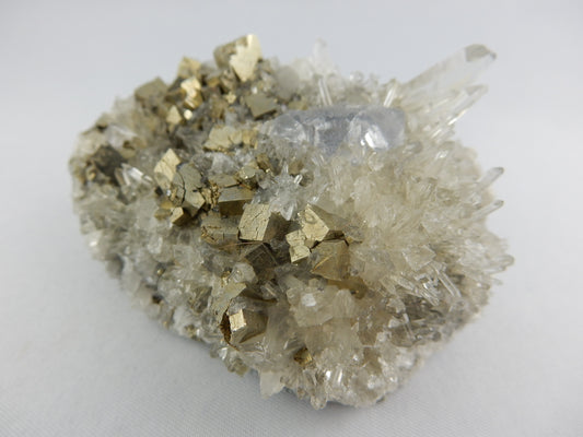 Interesting combo specimen - gemmy purple fluorite nestled in a bed of bright pyrite with a scattering of gemmy needle quartz