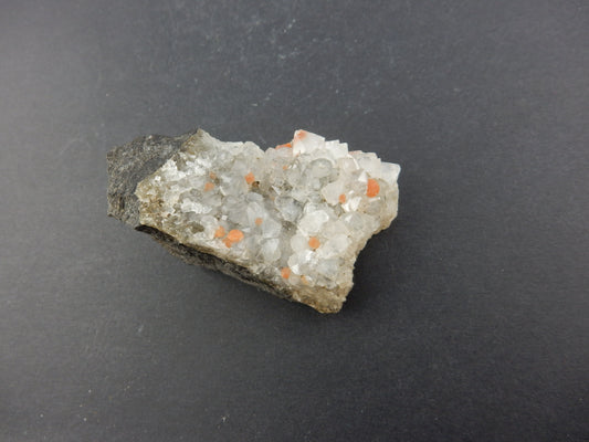 Rare botryoidal form of fluorite - red balls on plate of gemmy quartz crystals