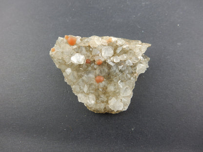 Rare botryoidal form of fluorite - red balls on plate of gemmy quartz crystals