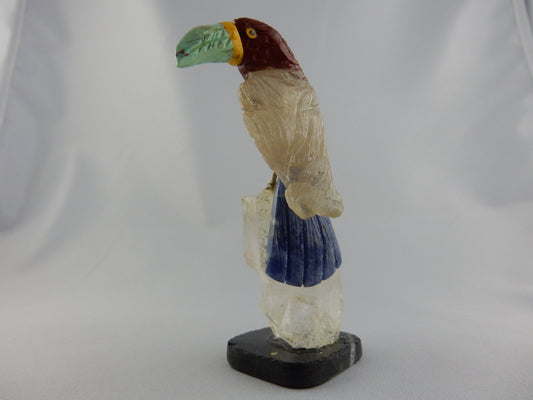 colourful gemmy bird - turquoise beak, pink agate head, quartz body, lapis lazuli  tail - perched on gemmy quartz cluster