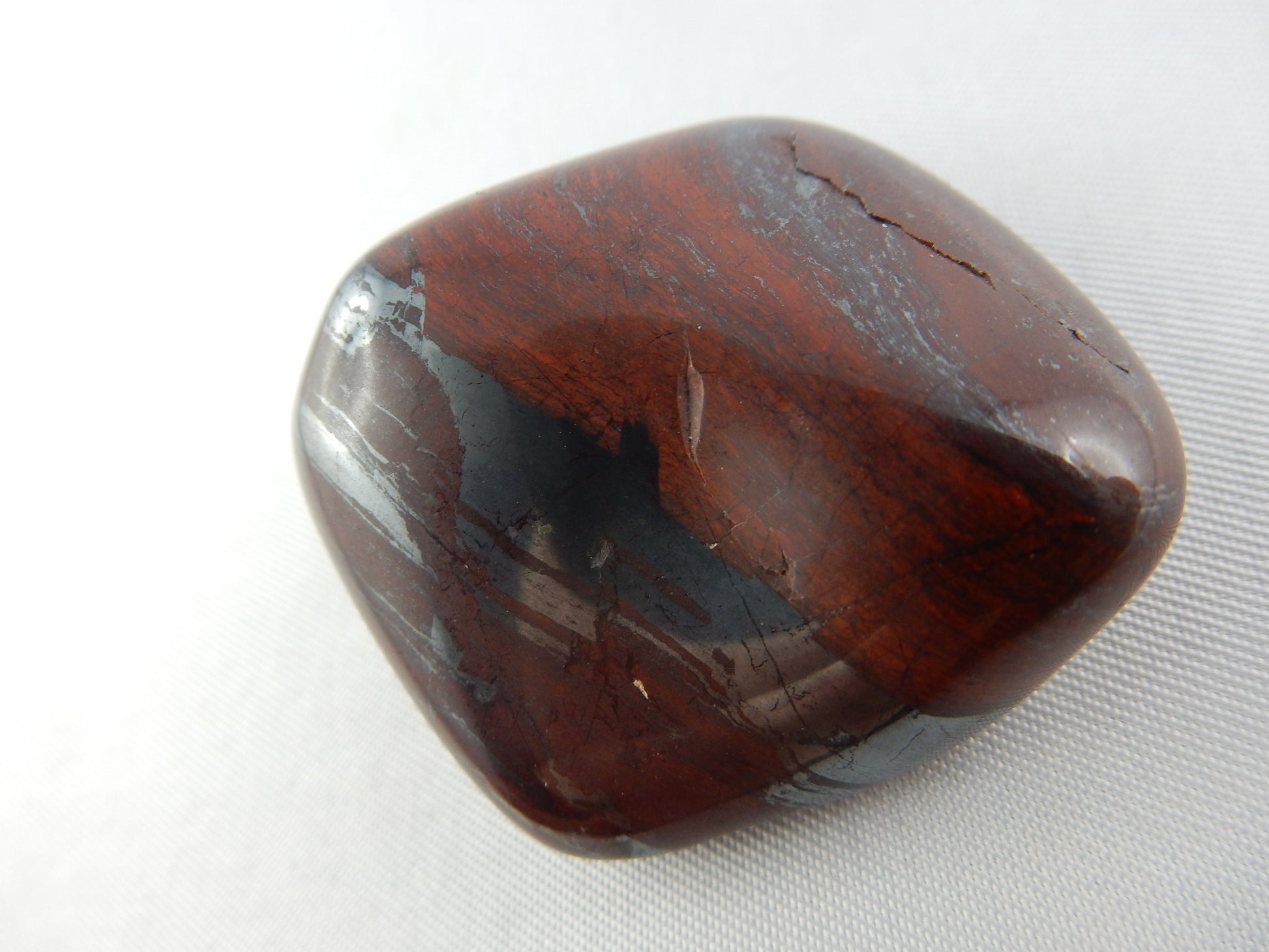 "Banded Iron" polished specimen - alternating bands of iron oxides and chert, of organic marine origin