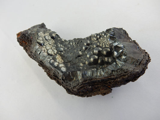 Amazing gemmy botryoidal mass sitting on curved bed of hematite