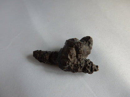 Cool pseudomorph of pyrite into goethite/hematite