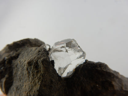 Genuine Herkimer (not Chinese) quartz crystal - cleaved but still nice, growing in vug in dolomite matrix