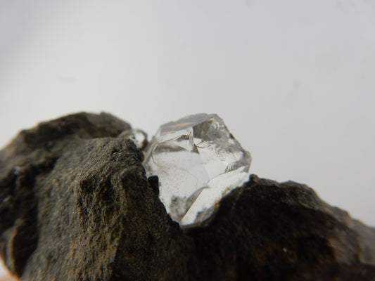 Genuine Herkimer (not Chinese) quartz crystal - cleaved but still nice, growing in vug in dolomite matrix