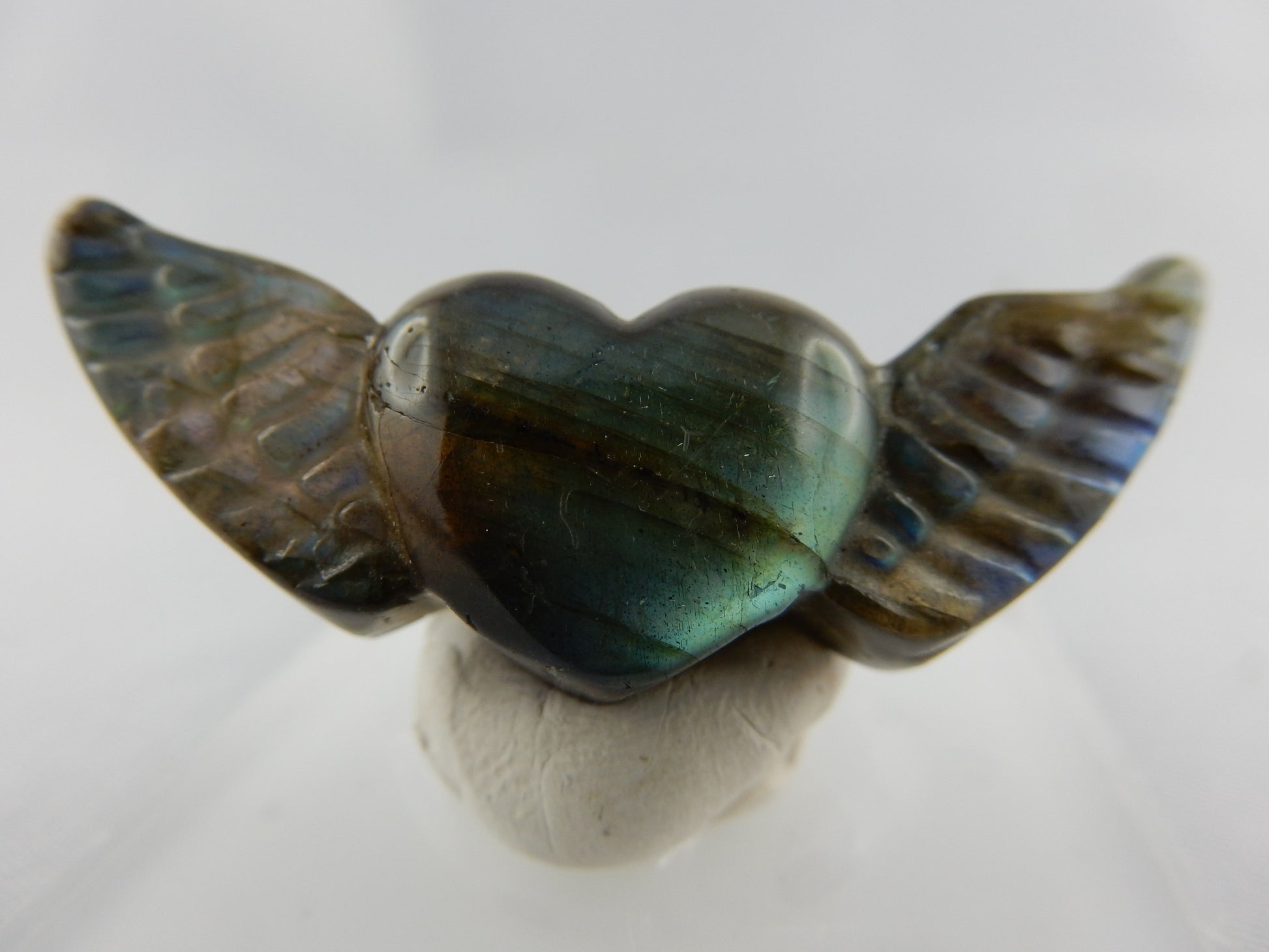 iridescent beautifully carved Labradorite heart ready to "take off"
