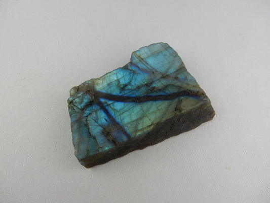 Clean cleavage block of blue-green-yellow colourful flashing and iridescent Labradorite (var. of plagioclase feldspar)