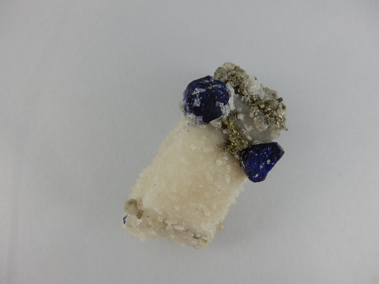 Two "eyes" royal blue "eye" crystals on calcite-pyrite-phlogopite matrix