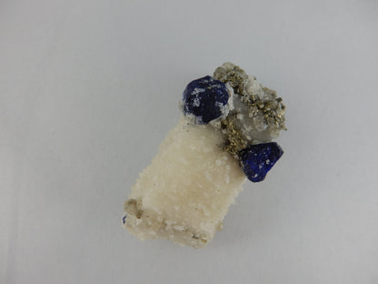 Two "eyes" royal blue "eye" crystals on calcite-pyrite-phlogopite matrix