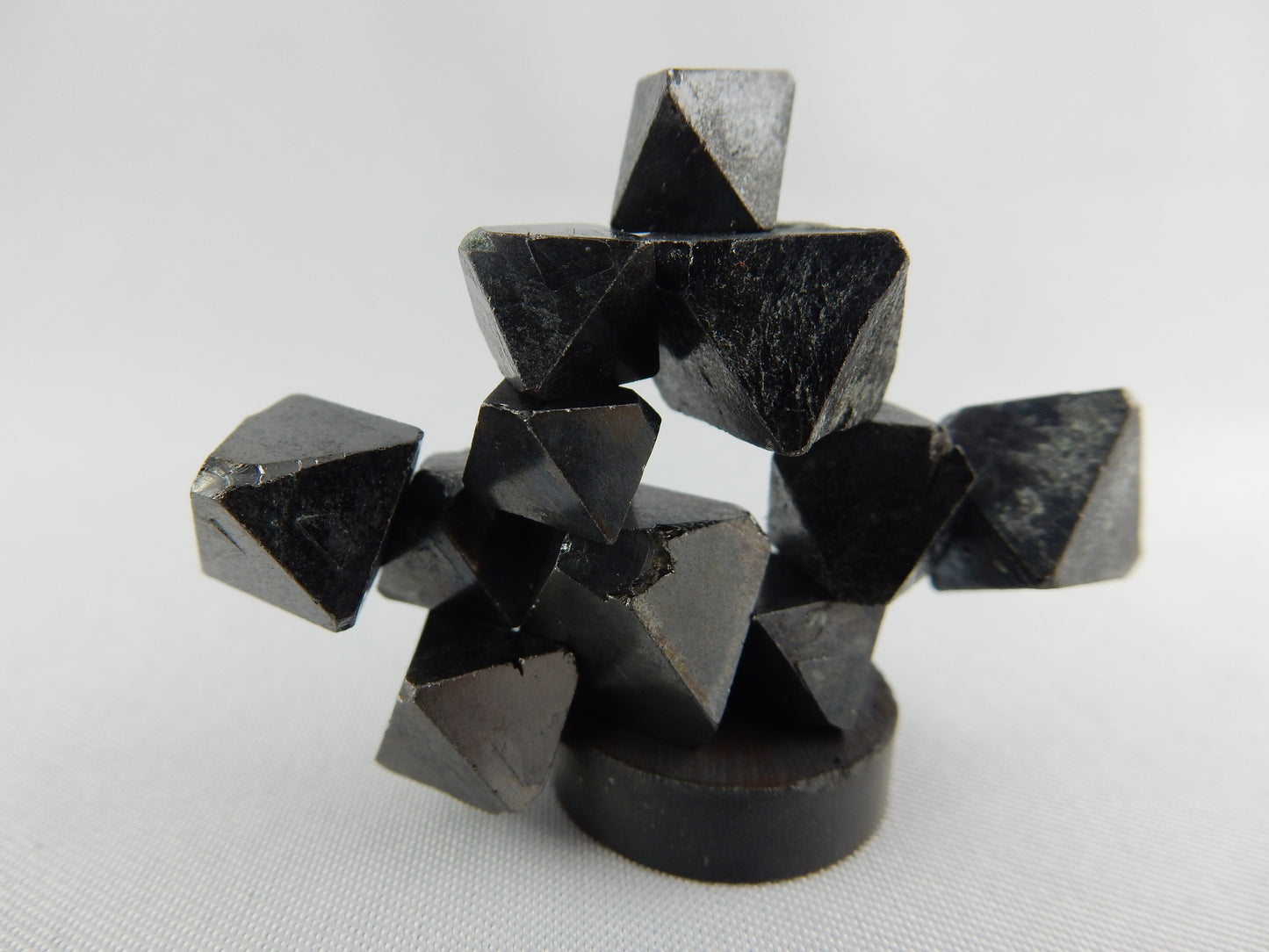 natural octahedral crystals of magnetite - strongly magnetic as a fun unique cluster