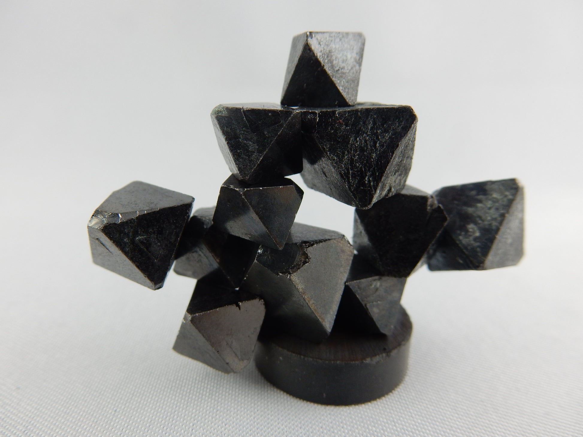 natural octahedral crystals of magnetite - strongly magnetic as a fun unique cluster