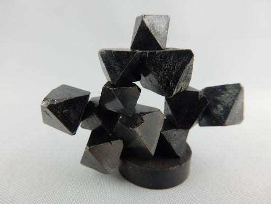 natural octahedral crystals of magnetite - strongly magnetic as a fun unique cluster
