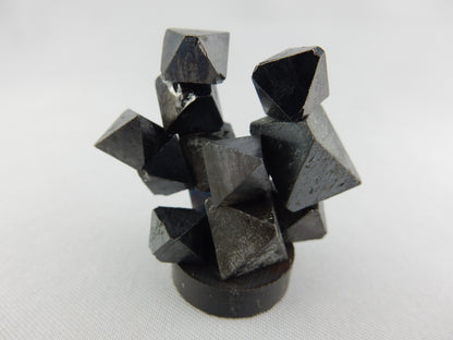 natural octahedral crystals of magnetite - strongly magnetic as a fun unique cluster