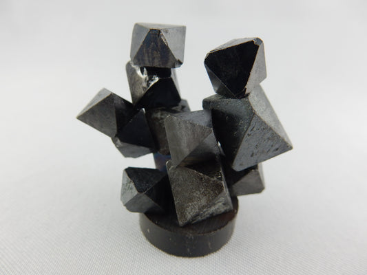 natural octahedral crystals of magnetite - strongly magnetic as a fun unique cluster