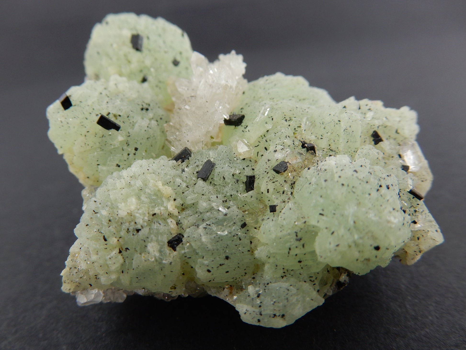 balls of green Prehnite with speckles of rare Babingtonite and nice sparkly quartz cluster as well