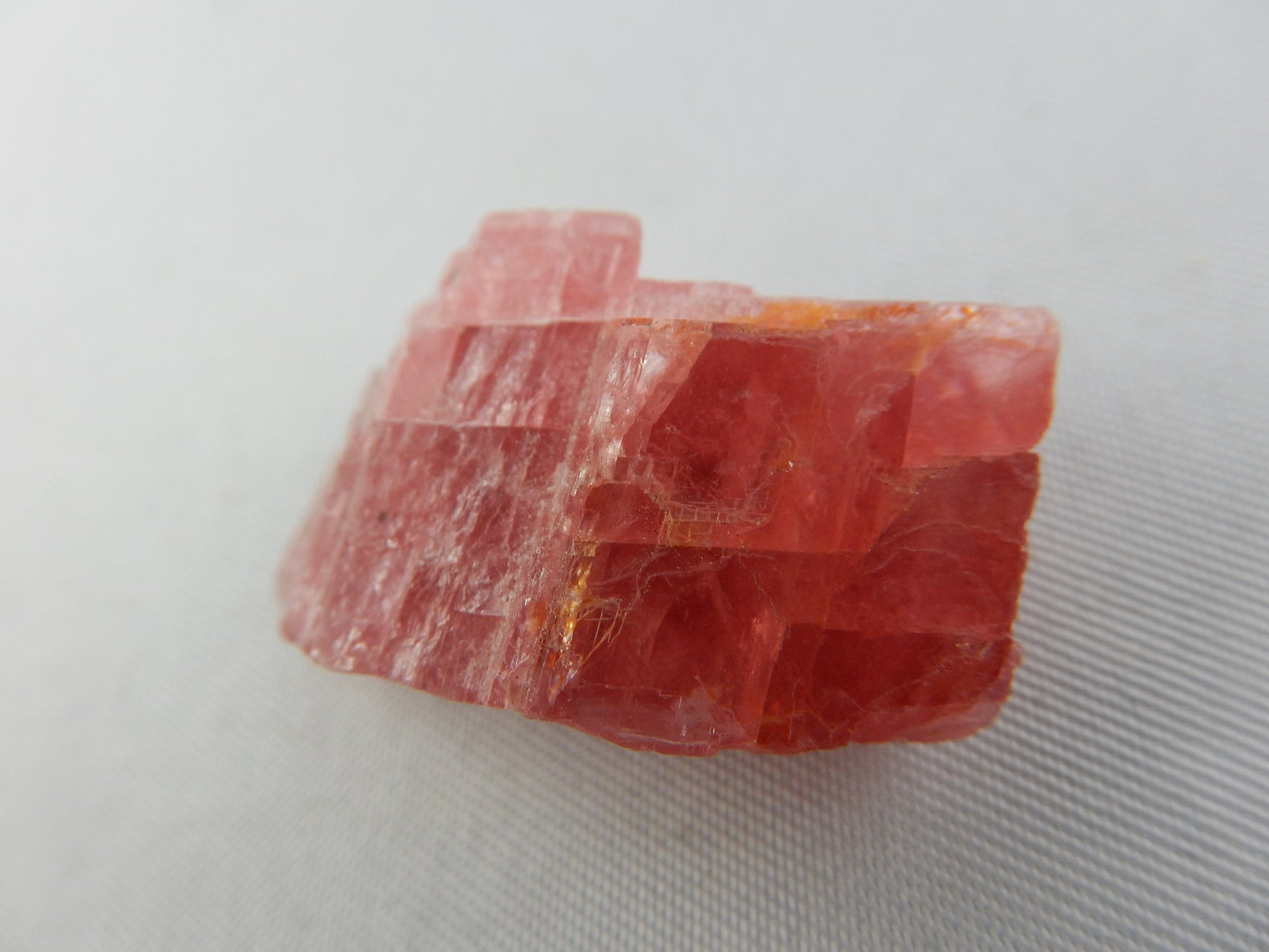 Rhodochrosite, Cherry-red gemmy rhomb cleavage crystal