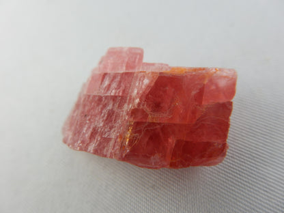 Rhodochrosite, Cherry-red gemmy rhomb cleavage crystal