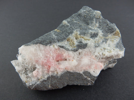 beautiful "seam" rhodochrosite  enclosed in quartz seam within limestone matrix