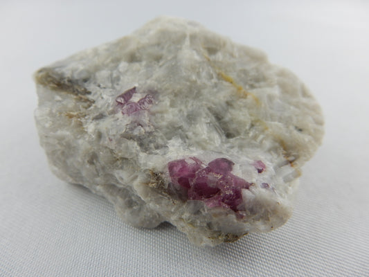 multiple double-terminated Ruby cluster with hematite inclusions at tips - multiple "sidecar" crystals all double terminated