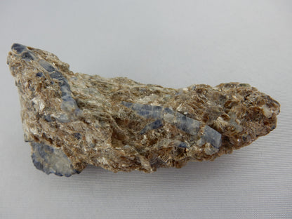 multiple deep blue/white Sapphire scaledahedron double terminated crystals "floating" in a bed of sparkly muscovite