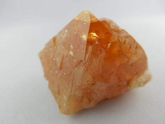 gemmy orange octahedron cluster of Scheelite with muscovite skin- brilliant shining tip
